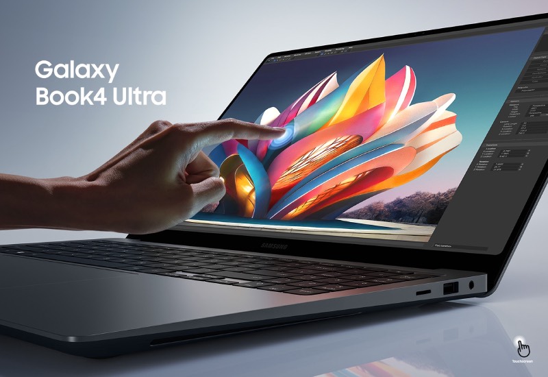 Fnac: imagen promocional de estudio del ordenador portátil Samsung Galaxy Book4 Ultrafino con una mano que muestra la función táctil sobre la pantalla