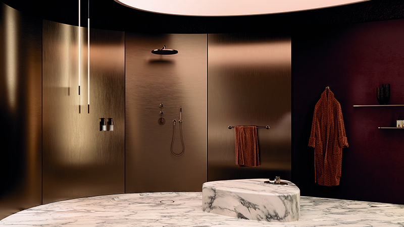 Dornbracht: un elegante y amplio baño con una gama cromática oscura y cálida, a juego con el tono bronce polifacético de la grifería.