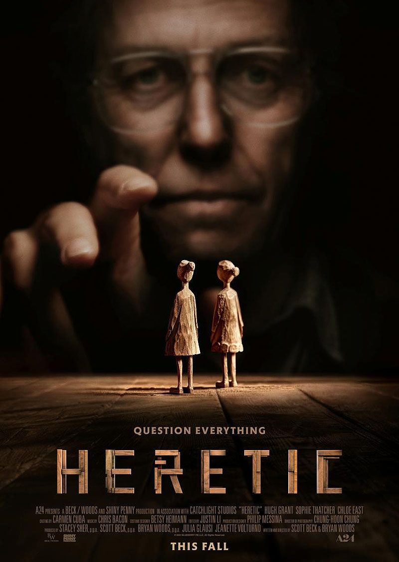 Heretic - poster de la película se ve al actor Hugh Grant con 2 pequeñas muñecas de madera