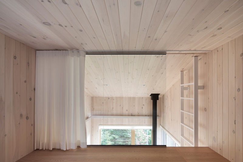 Quinzhee-Architecture-Blok: buhardilla revestida de madera con cortina